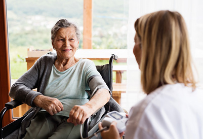 Lady in a wheelchair with carer