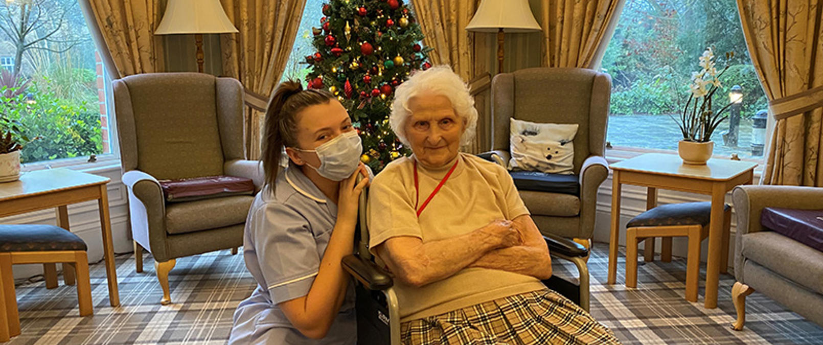 Care assistant with resident at Christmas