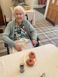 Elderly lady with her decorated poppy biscuits